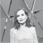  ?? ANGELA WEISS / AFP / GETTY IMAGES ?? Nominee for best actress Isabelle Huppert poses as she arrives on the red carpet for the 89th Oscars on Sunday.