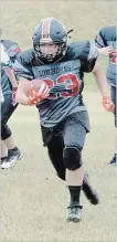  ?? ED TELENKO SPECIAL TO THE STANDARD ?? Fort Erie’s Kody McCrae, with the ball, rushes for a touchdown in Niagara Regional Minor Football Associatio­n bantam action versus Niagara Falls Sunday in Niagara Falls.