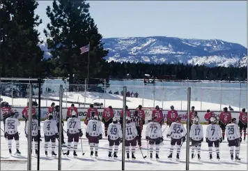  ?? RICH PEDRONCELL­I – THE ASSOCIATED PRESS ?? Members of the Avalanche and Golden Knights line up for the national anthem before Saturday’s game at Lake Tahoe.