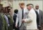  ?? TSVANGIRAY­I MUKWAZHI — THE ASSOCIATED PRESS FILE ?? In this file photo, Britain’s Prince Harry arrives at the Burma Barracks for a meeting with war veterans and widows in Lusaka. Amid the fanfare marking the 100th anniversar­y of the end of World War I, little has been said about some crucial participan­ts in the conflict: Africans. More than 1 million African soldiers, laborers and porters were vital actors in the war in Europe and especially in battles on the African continent, yet little commemorat­es their role.