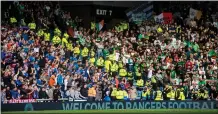  ??  ?? Celtic and Rangers fans are segregated during matches