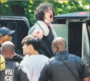  ?? AFP ?? A protestor yells as he is loaded into a police van after being arrested during a pro-Palestinia­n demonstrat­ion at Emory University, in Atlanta, Georgia, on Thursday.