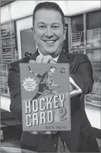  ?? SUBMITTED PHOTO ?? Author/sports anchor Ken Reid poses with his new book, “Hockey Card Stories 2.”