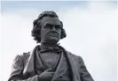  ??  ?? A 9-foot statue of Stephen Douglas stands atop a 96-foot pedestal in Bronzevill­e. TYLER LARIVIERE/SUN-TIUMES