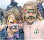  ??  ?? Erin McIntosh and Leah Ross sporting colourful designs on their faces.