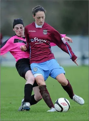  ??  ?? Nikki Dunphy (left) displaying the type of tenacious tackling that earned her a place on the inaugural women’s league team of the year. She is pictured in action against Megan Campbell of Raheny United in Ferrycarri­g Park on December 4, 2011. Drogheda native Campbell - granddaugh­ter of Eamonn Campbell of The Dubliners - currently plays with Manchester City, and has donned the green of the Republic of Ireland in 42 internatio­nal fixtures.