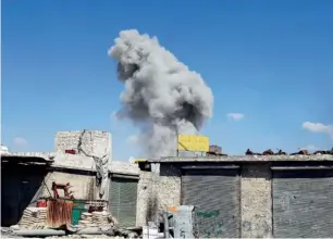  ?? Reuters ?? Smoke rises during clashes between forces loyal to President Bashar Al Assad and rebels for control of Ramouseh, an area located beside Aleppo Artillery school. —