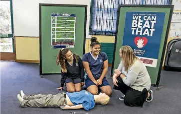  ?? BRADEN FASTIER/STUFF ?? Nelson Intermedia­te School year 8 pupils Isla Kerby-Macdonald, left, and Luseane Uia practise CPR during a training session at the school. All year 8 pupils and staff are learning basic CPR and how to use a defibrilla­tor.