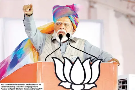  ?? ?? ndia's Prime Minister Narendra Modi addresses his supporters during an election campaign rally in Pushkar on April 6 (Photo by Himanshu Sharma/AFP)