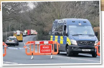  ??  ?? The scene of the barn fire in Parbold, above, and, left, emergency service vehicles line the road during the search for Louis