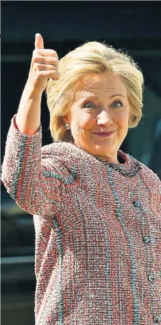  ??  ?? Back in action: Hillary Clinton boarding her campaign plane on Thursday