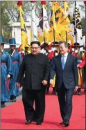  ?? KOREA SUMMIT PRESS POOL ?? Left: North Korean leader Kim Jong Un, left, with South Korean President Moon Jae-in during a welcome ceremony at the border village of Panmunjom in the Demilitari­zed Zone, South Korea on Friday.