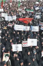  ?? EBRAHIM NOROOZI/AP ?? Iranian protesters chant slogans at a rally Saturday in Tehran.