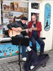  ?? Photo by Michelle Cooper Galvin ?? Busker Kit McCafferty (left) with Kit Dunlop of The Soundz of Music, Henry Street, Kenmare.