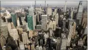  ?? TED SHAFFREY — THE ASSOCIATED PRESS FILE ?? The Manhattan skyline is seen from the observator­y of the Empire State Building in New York City.