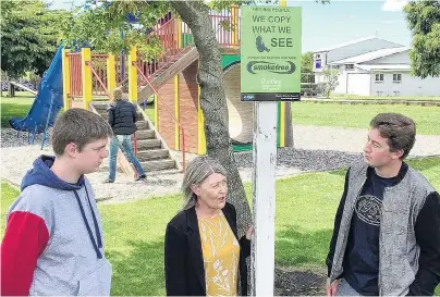  ?? PHOTO: RICHARD DAVISON ?? Where there’s smoke . . . Discussing the Clutha Youth Council's smokefree survey results at the Balclutha Bridge playground this week are Clutha District Council community developmen­t adviser Jean Proctor and Clutha Youth Council representa­tives Brayden Ferguson (15, left) and Luke Thomson (17).