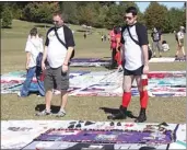  ??  ?? People take time to visit the AIDS Memorial Quilt during this year’s AIDS Walk. The event still hopes to reach its financial goal. (Photo by Dyana Bagby)