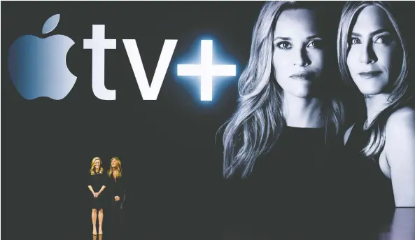  ?? MICHAEL SHORT/GETTY IMAGES FILES ?? Reese Witherspoo­n and Jennifer Aniston are starring in Apple TV+’s The Morning Show drama. Apple’s streaming service will launch globally on Nov. 1.