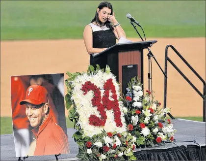 ?? AP PHOTO ?? Brandy Halladay, widow of Roy Halladay, talks about her husband during a memorial tribute at the Philadelph­ia Phillies’ spring training stadium on Tuesday in Clearwater, Fla.