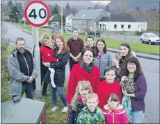  ?? Photograph: Iain Ferguson, alba.photos ?? MSP Kate Forbes joined local resident Katie Daynes and other protestors to ask for a reduced speed limit outside St Bride’s Primary School.