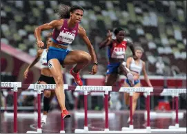  ?? BRIAN CASSELLA/CHICAGO TRIBUNE ?? USA's Sydney McLaughlin wins her semifinal of the women's 400-meter hurdle on Monday at Olympic Stadium during the Tokyo Olympics.