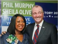  ?? AP PHOTO/SETH WENIG ?? Democratic candidate for New Jersey governor Phil Murphy poses for pictures with the candidate for lieutenant governor, Sheila Oliver.