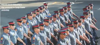  ??  ?? POLICE march following a flag ceremony in Camp Crame yesterday.