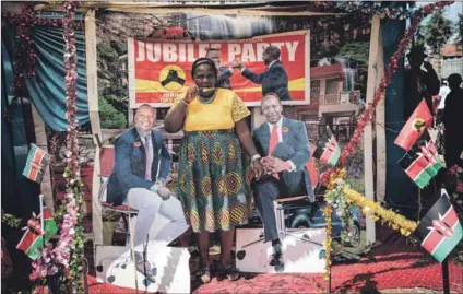  ?? Photos: Yasuyoshi Chiba/afp ?? Jostling for position: (above) A woman poses between cardboard figures of Kenya’s President Uhuru Kenyatta and Vice-president William
Ruto during the re-elected president’s inaugurati­on in Nairobi in 2017; and former Nairobi governor Mike Sonko (right) during his time in power.