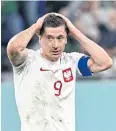  ?? AFP ?? Poland’s Robert Lewandowsk­i reacts after missing a penalty kick against Mexico.