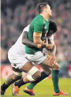  ??  ?? Courtney Lawes of England tackles Jonny Sexton of Ireland at the Aviva Stadium