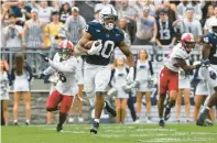  ?? BARRY REEGER/AP ?? Penn State’s Nicholas Singleton returns a kick against Indiana during the second half. On offense, Singleton carried 15 times for 50 yards and one touchdown and caught five passes for 31 yards.