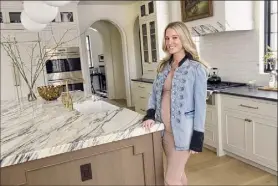  ?? Lori Van Buren / Times Union ?? Andrea Zappone, the grand prize winner in last year’s Times Union Home Design Contest, stands in her Saratoga Springs kitchen.