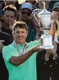  ?? Associated Press ?? Brooks Koepka holds up the winning trophy after the U.S. Open golf tournament Sunday at Erin Hills in Erin, Wis.