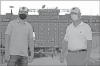  ?? Courtesy of the Baltimore Orioles ?? Former Arkansas Razorback Heston Kjerstad, left, and Baltimore Orioles General Manager Mike Elias pose in front of Camden Yards in Baltimore recently. The second overall pick in the 2020 MLB Draft, Kjerstad signed a contract worth $5.2 million.