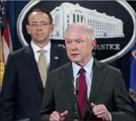  ?? ANDREW HARNIK — THE ASSOCIATED PRESS ?? Attorney General Jeff Sessions, accompanie­d by Deputy Attorney General Rod Rosenstein, speaks at a news conference at the Justice Department in Washington.