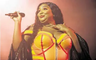  ?? Owen Sweeney / Associated Press ?? Lizzo, who grew up in Houston, earned eight Grammy Award nomination­s, making her the top-nominated act. The 62nd Grammy Awards will take place Jan. 26 in Los Angeles.