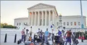  ?? AFP ?? Journalist­s set up in front of the US Supreme Court building on Monday ahead of Trump’s announceme­nt.