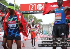  ??  ?? Hats tip: Kitata (far left) enjoys his victory in soggy London as Kipchoge trails in a distant eighth