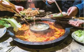  ??  ?? FROM TOP: Tianfu Square; a fish hotpot