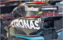  ?? ?? All change: The lettering in the sponsors’ logo (1) from earlier in the season is different on the new-look fuller sidepod (2)