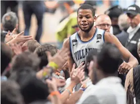  ?? SHANNA LOCKWOOD/USA TODAY SPORTS ?? Villanova freshman Omari Spellman scored 15 points, including three threepoint­ers, in Saturday’s rout of Kansas.