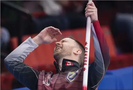  ?? The Canadian Press ?? Team Canada skip Brad Gushue reacts to his shot during the 18th draw against Northern Ontario at the Brier in Brandon, Man., on Friday.