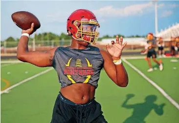  ?? [PHOTOS BY SARAH PHIPPS, THE OKLAHOMAN] ?? Junior quarterbac­k Aaron Norment hopes to have a breakout season for Putnam City North, which wants to improve on a 3-7 season a year ago.