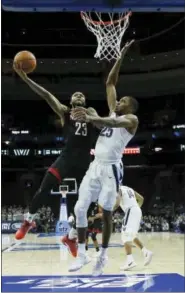  ?? MATT SLOCUM — THE ASSOCIATED PRESS ?? Villanova’s Mikal Bridges, right, goes up to block a shot by Nicholls State’s Roddy Peters during the first half of Tuesday night’s college basketball game.