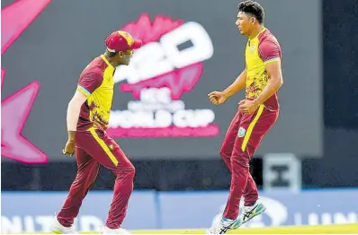  ?? CWI PHOTO ?? West Indies players Akeal Hosein (Left) and Gudakesh Motie in a celebrator­y mood.