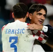  ?? Photo: Nampa/AFP ?? Unfazed… Croatia’s coach Zlatko Dalic celebrates with Croatia’s defender Borna Barisic after beating Japan at the Al-Janoub Stadium in Al-Wakrah, Doha on Monday.