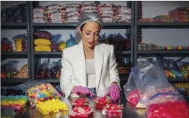  ?? MELISSA GOLDEN — THE NEW YORK TIMES ?? Elizabeth Schmitt, 37, is a self-professed gummy fanatic who owns Ruby Bond in Atlanta. “Gummy candy is so nostalgic,” she said. “It reminds me of simpler times.”