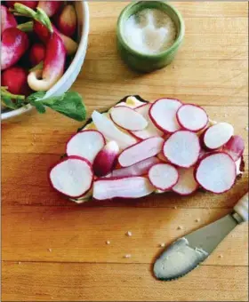  ?? ELIZABETH KARMEL VIA ASSOCIATED PRESS ?? This June 3, 2018 photo shows radishes and open-faced radish tartine in Amagansett, N.Y. A tartine is not a complicate­d dish. It is simply the French name for open-faced sandwich.