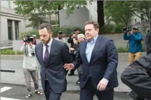  ?? BRYAN R SMITH/THE NEW YORK TIMES ?? Murray Huberfeld (right) a former executive of the hedge fund Platinum Partners, exits Manhattan Federal District Court following his arraignmen­t on federal corruption charges, in New York on June 8.