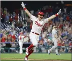  ?? TIM NWACHUKWU – GETTY IMAGES ?? Rhys Hoskins of the Philadelph­ia Phillies is elated after doubling home the winning run in the bottom of the ninth to defeat the Miami Marlins on Monday night at Citizens Bank Park.